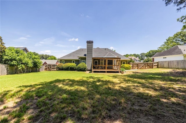 3845 Glen Ian Dr, Loganville, GA 30052 - rear view of property with a deck and a chimney