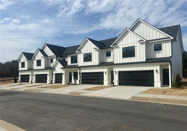 212 Starr Cir, Stockbridge, GA 30281 - modern inspired farmhouse featuring board and batten siding, a garage, concrete driveway, and a shingled roof