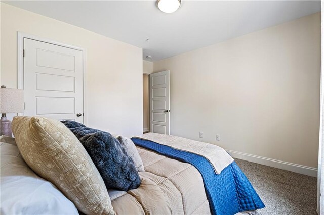 212 Starr Cir, Stockbridge, GA 30281 - carpeted bedroom featuring baseboards