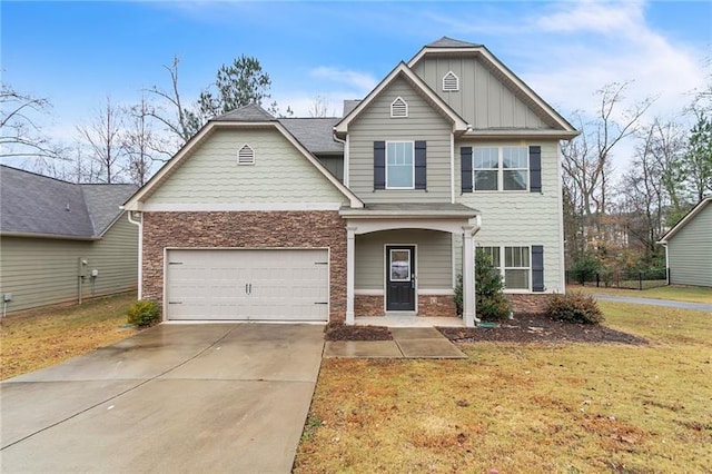 craftsman-style house with a front lawn, driveway, stone siding, board and batten siding, and a garage