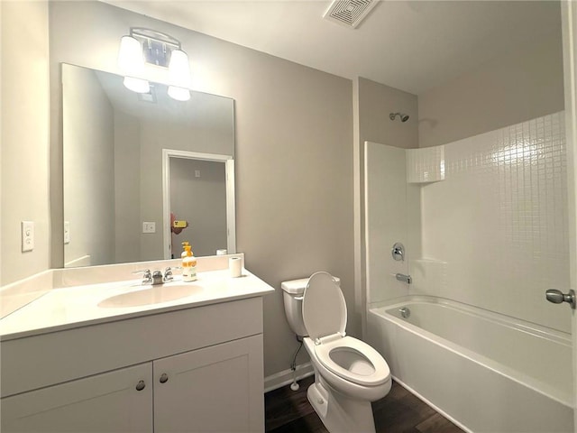 2059 Lanier Harbor Pt, Buford, GA 30518 - bathroom with tub / shower combination, wood finished floors, and vanity