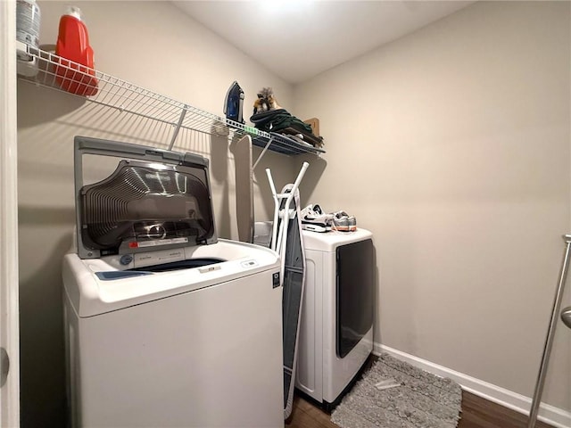 2059 Lanier Harbor Pt, Buford, GA 30518 - washroom with washing machine and clothes dryer and dark wood finished floors