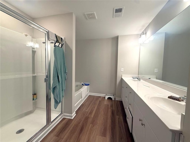 2059 Lanier Harbor Pt, Buford, GA 30518 - full bath with wood finished floors, a stall shower, a garden tub, and double vanity