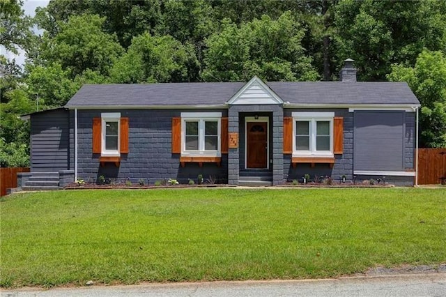 view of front of home with a front lawn