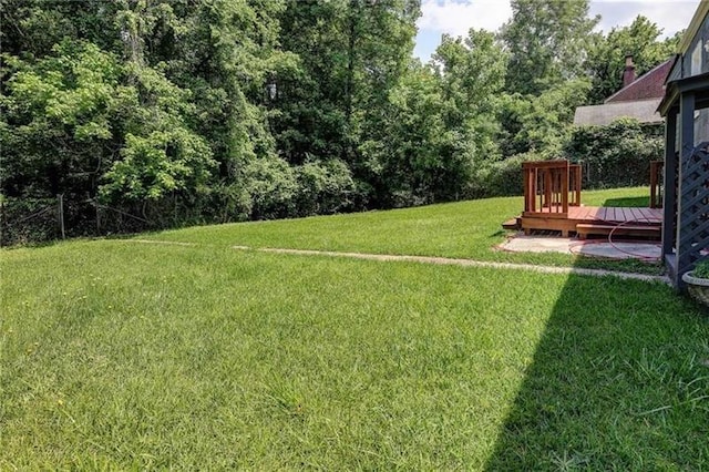 view of yard with a deck