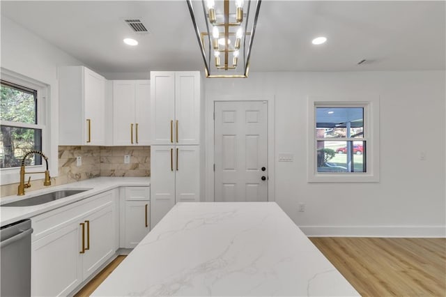 2358 Tilson Rd, Decatur, GA 30032 - kitchen featuring dishwasher, white cabinets, light wood-style floors, tasteful backsplash, and recessed lighting