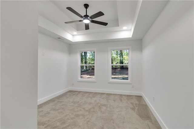 2358 Tilson Rd, Decatur, GA 30032 - spare room featuring light colored carpet, a ceiling fan, a tray ceiling, and recessed lighting