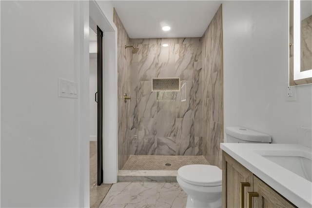 2358 Tilson Rd, Decatur, GA 30032 - full bath featuring marble look tile flooring, vanity, a marble finish shower, and recessed lighting