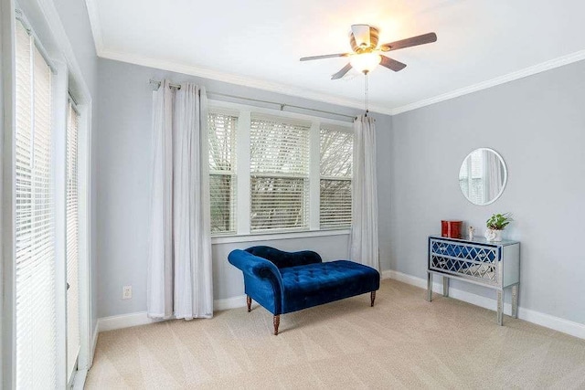 living area with ornamental molding, plenty of natural light, and light colored carpet