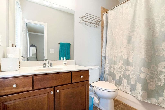 full bathroom with crown molding, shower / tub combo, vanity, tile patterned floors, and toilet