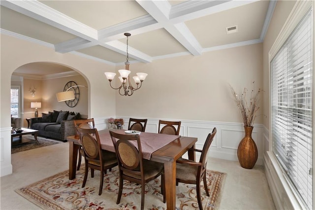 1307 Clarecastle Ln, Buford, GA 30519 - dining room featuring arched walkways, a chandelier, beamed ceiling, wainscoting, and coffered ceiling