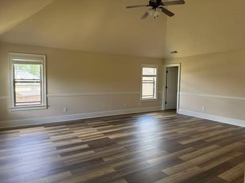 1307 Clarecastle Ln, Buford, GA 30519 - empty room featuring ceiling fan, dark wood-style flooring, baseboards, and high vaulted ceiling