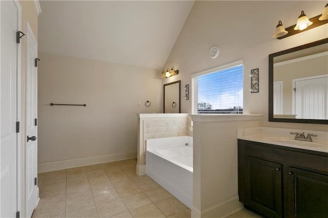 1307 Clarecastle Ln, Buford, GA 30519 - bathroom with lofted ceiling, a bath, vanity, tile patterned floors, and baseboards