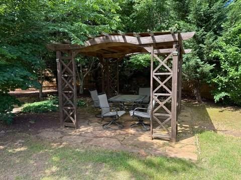 1307 Clarecastle Ln, Buford, GA 30519 - view of yard with a wooded view
