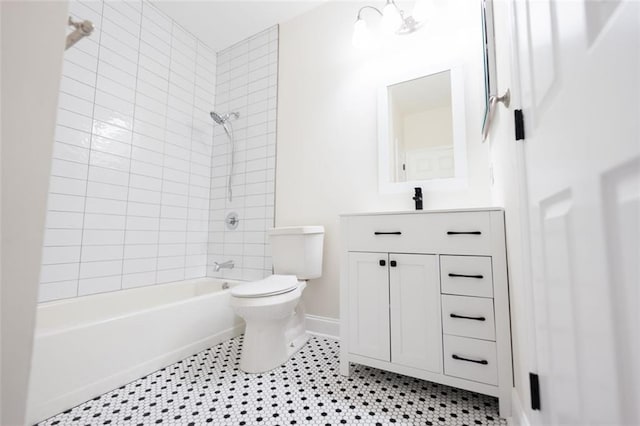 full bathroom featuring tile patterned flooring, vanity, toilet, and tiled shower / bath combo