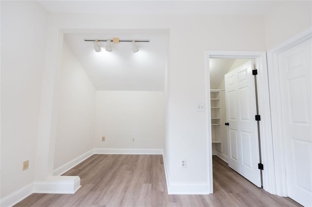 additional living space featuring light hardwood / wood-style flooring