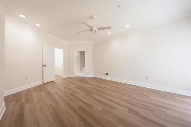 spare room featuring ceiling fan, crown molding, and light hardwood / wood-style flooring