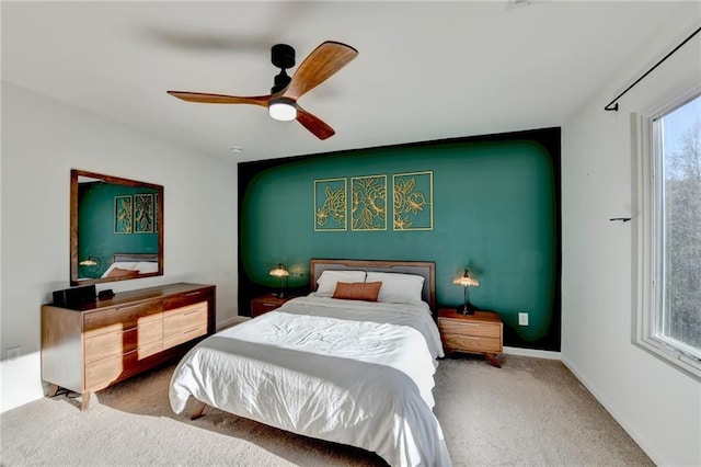 bedroom featuring carpet flooring, ceiling fan, and baseboards