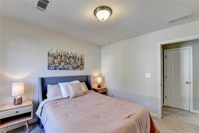 bedroom featuring light carpet, baseboards, and visible vents