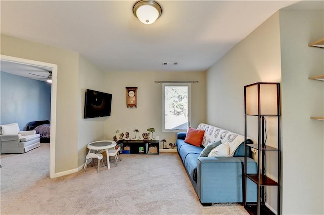 carpeted living area with visible vents and baseboards