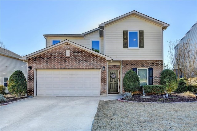 traditional-style house featuring an attached garage, driveway, and brick siding