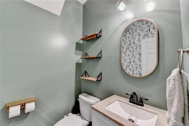 half bath with vanity and toilet