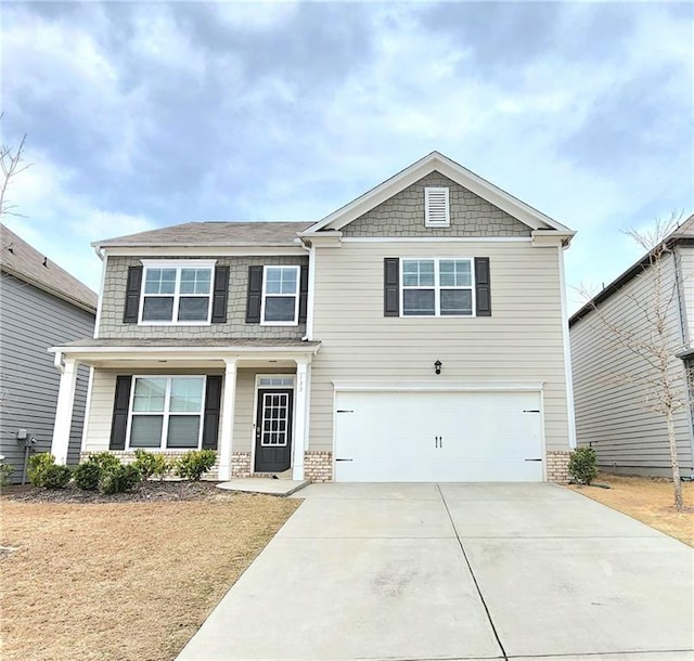133 Wayside Ter, Braselton, GA 30517 - view of front of home with a garage, driveway, and a porch