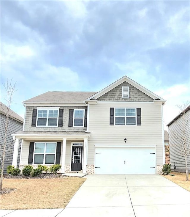 133 Wayside Ter, Braselton, GA 30517 - view of front of house featuring an attached garage and driveway