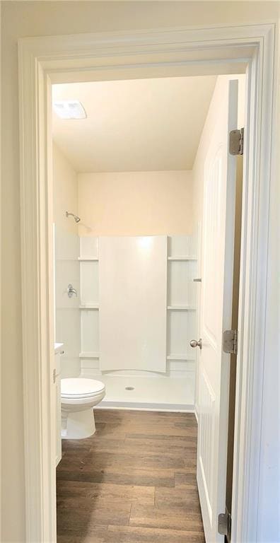 133 Wayside Ter, Braselton, GA 30517 - bathroom with a stall shower, wood finished floors, and toilet