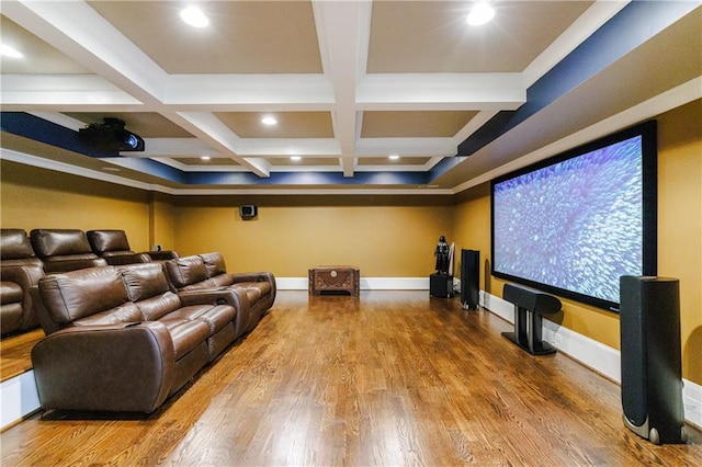 home theater featuring beam ceiling, hardwood / wood-style flooring, and coffered ceiling