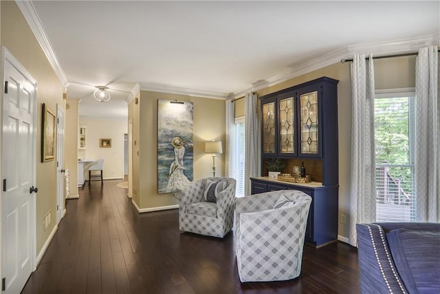 living area featuring crown molding, baseboards, and dark wood-style floors