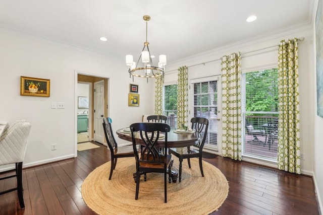 dining area featuring a chandelier, ornamental molding, dark wood-type flooring, baseboards, and recessed lighting