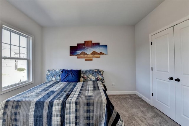 bedroom with carpet flooring and a closet