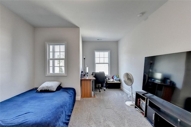 bedroom with light colored carpet