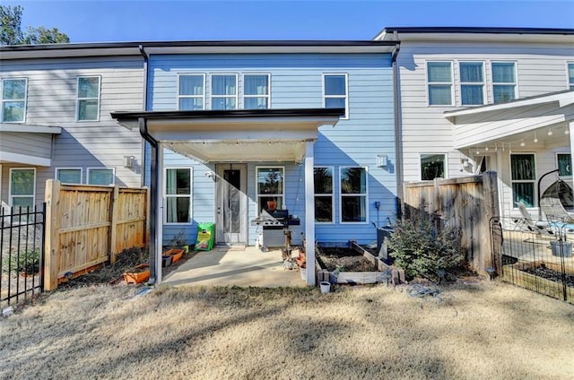 rear view of house featuring a patio