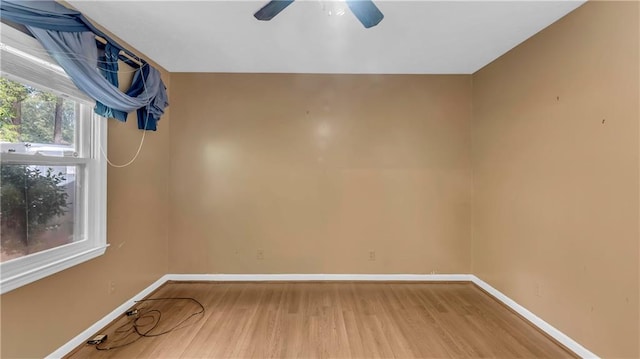 spare room featuring ceiling fan and hardwood / wood-style flooring