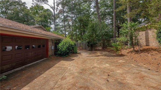 view of yard featuring a garage