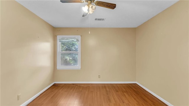 unfurnished room with ceiling fan and hardwood / wood-style floors