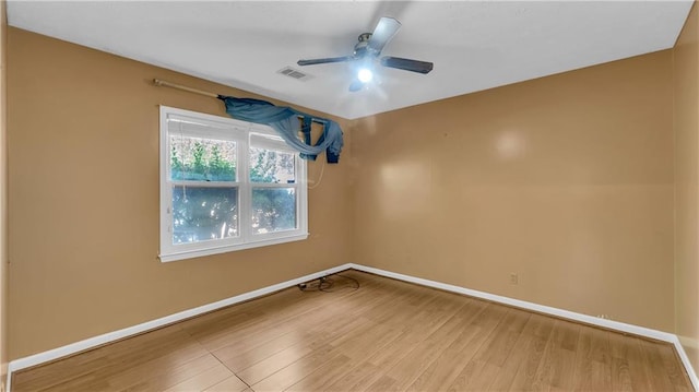 unfurnished room with wood-type flooring and ceiling fan