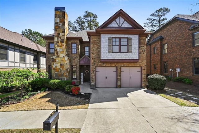 4782 Lakeway, Alpharetta, GA 30005 - tudor home featuring a chimney, driveway, and an attached garage
