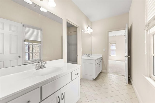 4782 Lakeway, Alpharetta, GA 30005 - bathroom with tile patterned flooring, a sink, baseboards, and two vanities