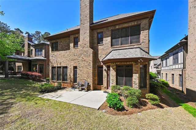 4782 Lakeway, Alpharetta, GA 30005 - rear view of house with a lawn, a chimney, a patio, and brick siding