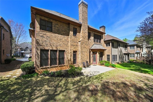 4782 Lakeway, Alpharetta, GA 30005 - rear view of property with a lawn, a chimney, a patio, and brick siding
