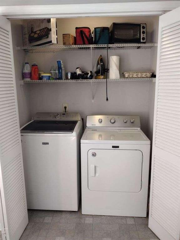 laundry room featuring independent washer and dryer and laundry area