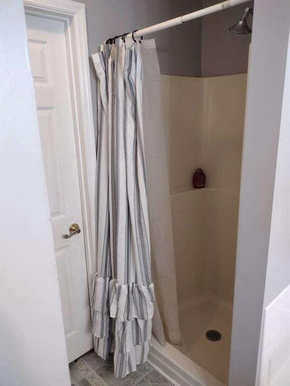 full bath featuring a stall shower