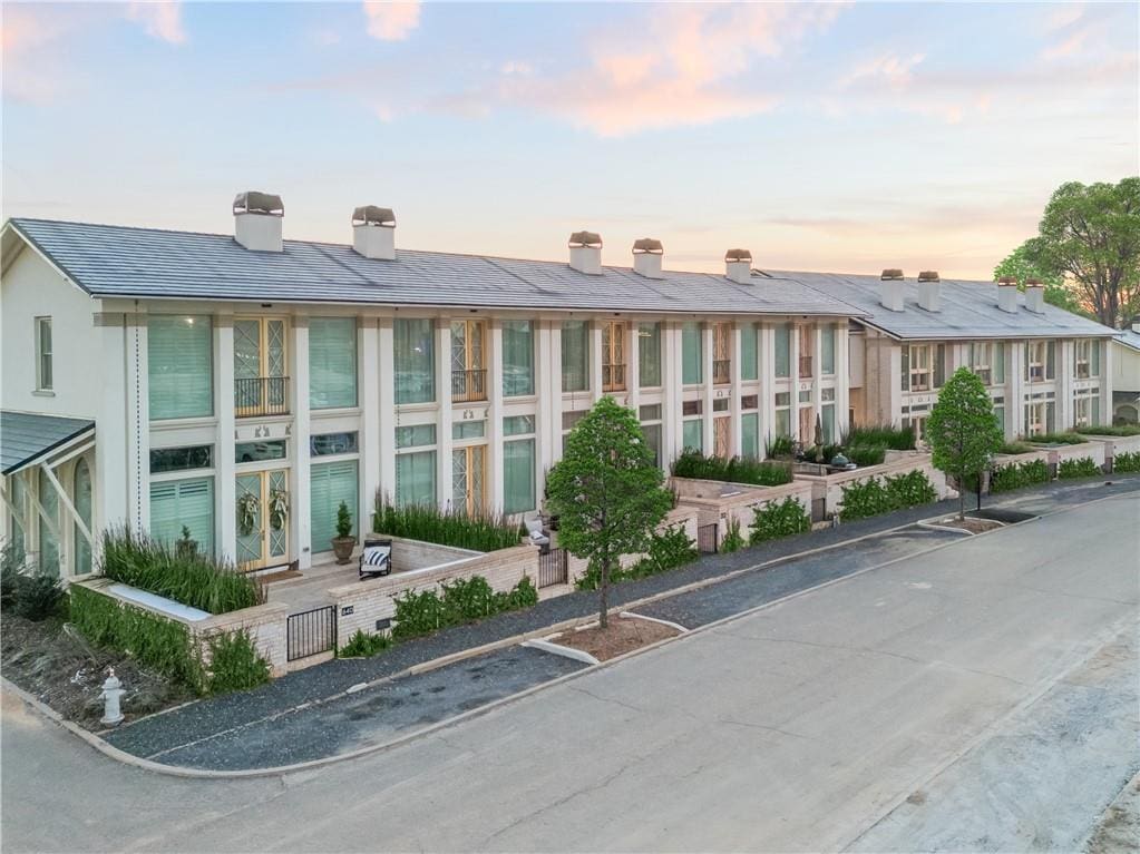 view of outdoor building at dusk