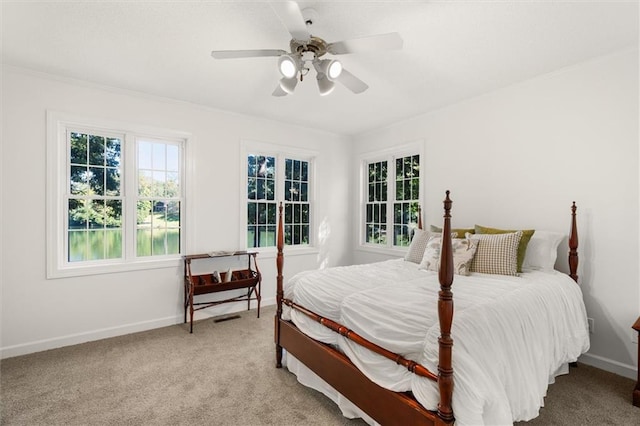 bedroom with light carpet and ceiling fan