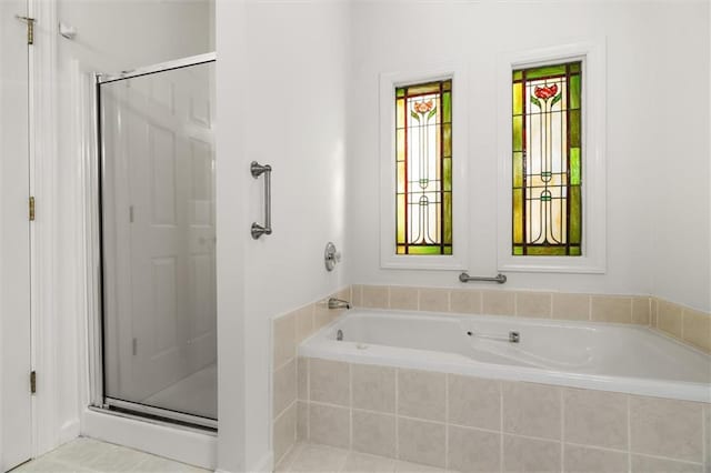 bathroom with tile patterned flooring and plus walk in shower