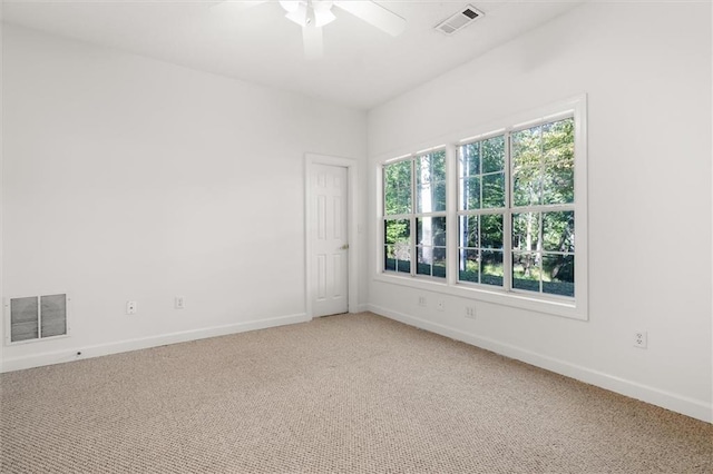 empty room with carpet and ceiling fan