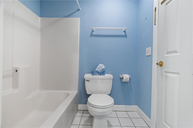 bathroom featuring toilet, bathing tub / shower combination, and tile patterned floors